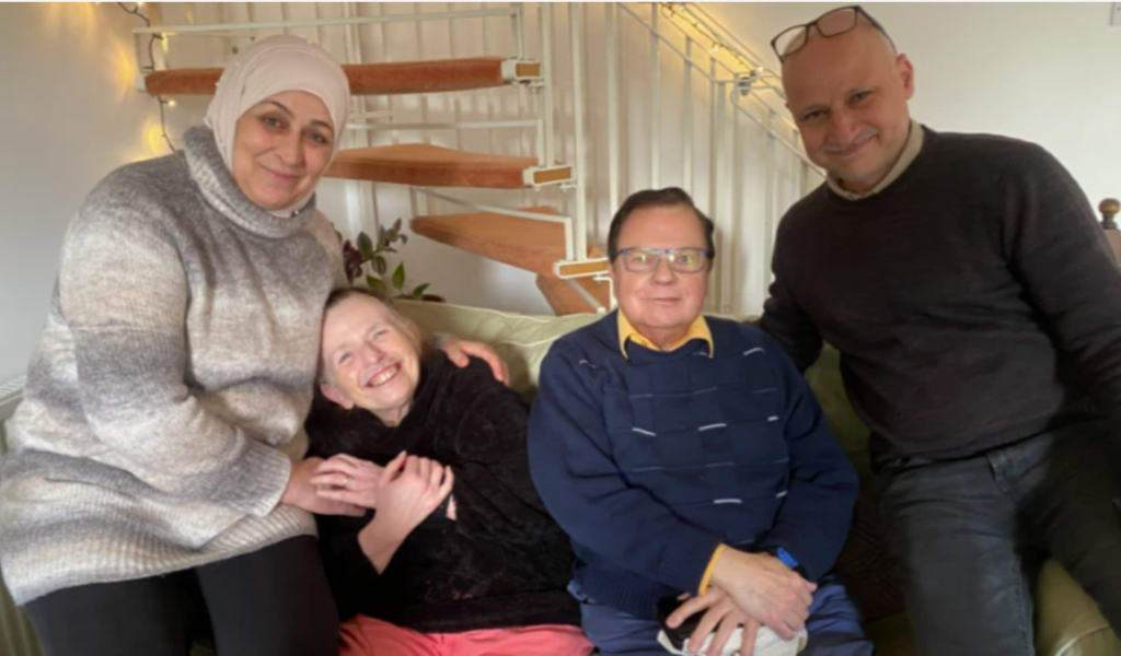 Bushra and Khaled, pictured far left and right, arrived in the UK with their daughter in 2023